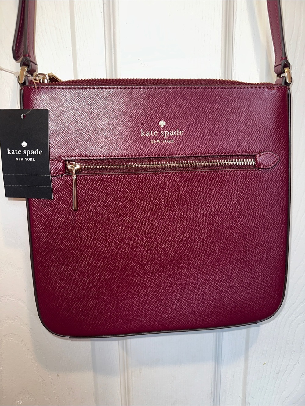 kate spade Sadie burgundy crossbody bag with gold hardware
